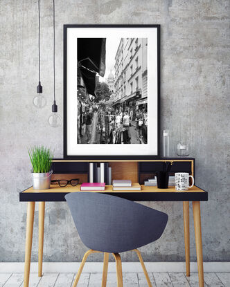 Black and white photograph of narrow street in Paris, France