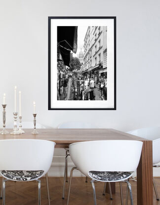 Black and white photograph of narrow street in Paris, France