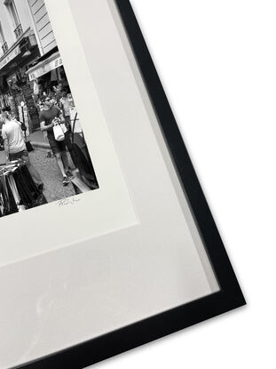 Black and white photograph of narrow street in Paris, France