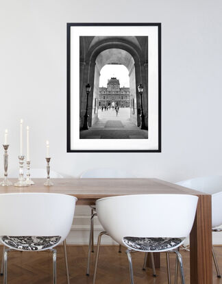 Black and white photograph of narrow street in Paris, France