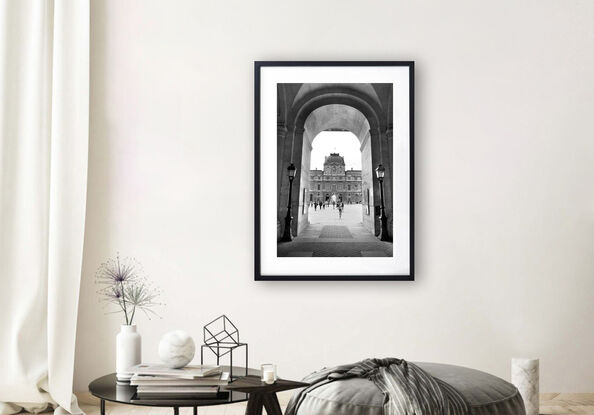 Black and white photograph of narrow street in Paris, France