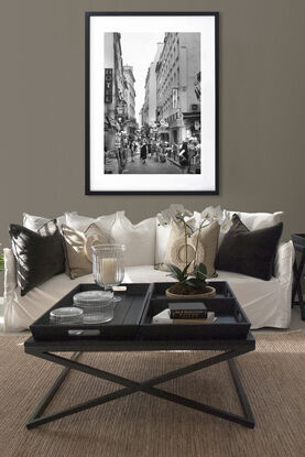 Black and white photograph of narrow street in Paris, France