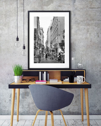 Black and white photograph of narrow street in Paris, France