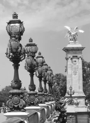 Black and white photograph of narrow street in Paris, France