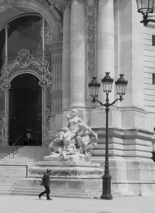 Black and white photograph of narrow street in Paris, France