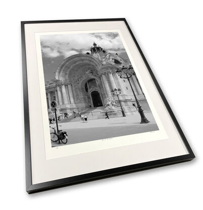 Black and white photograph of narrow street in Paris, France