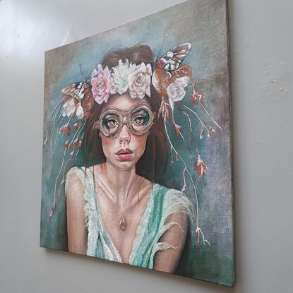 Woman with flowers and butterflies and steampunk goggles