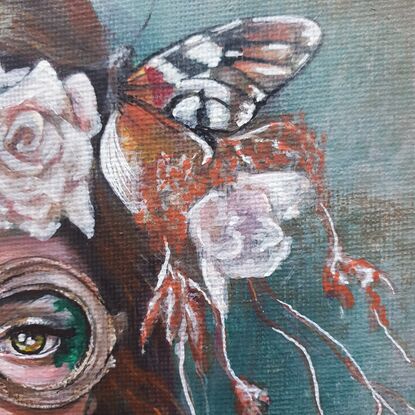 Woman with flowers and butterflies and steampunk goggles