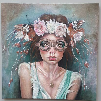 Woman with flowers and butterflies and steampunk goggles