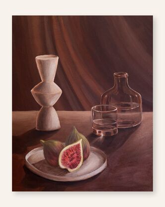 A side lit table scene with long shadows & a beam of light. A plate with figs in the foreground with a white modern vase, glass bottle and drinking glass with water in it.