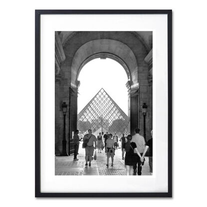 Black and white photograph of narrow street in Paris, France