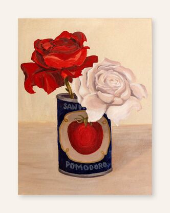 A vintage tomato tin is an unusual vase for a red & a white rose. Deep navy blue compliments to rich red of the rose.