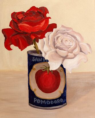 A vintage tomato tin is an unusual vase for a red & a white rose. Deep navy blue compliments to rich red of the rose.