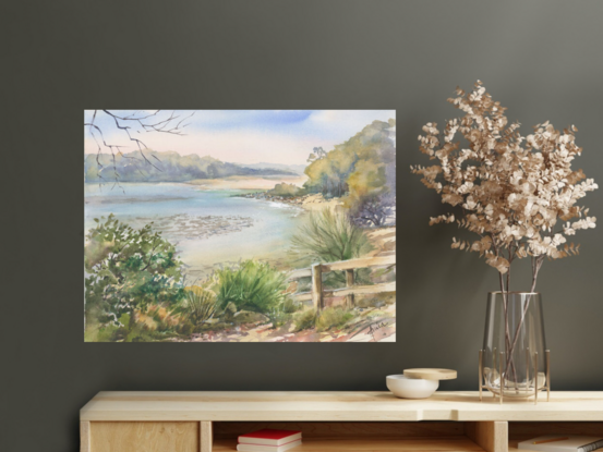 A peacefully serene scene of Narrawallee inlet with the water at half tide, timber steps in the left hand corner and vegetation in the foreground.