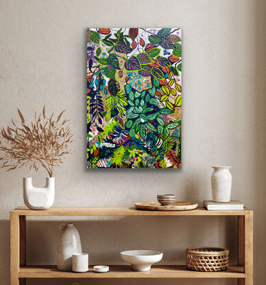 A mixture of brightly coloured leaves from orange and deep green with pink splashes, this is a jungle of leaves growing and climbing in harmony across the canvas. Painted areas and printed botanical pieces that pop through in a harmony the painting continues around the sides so no frame is required. 