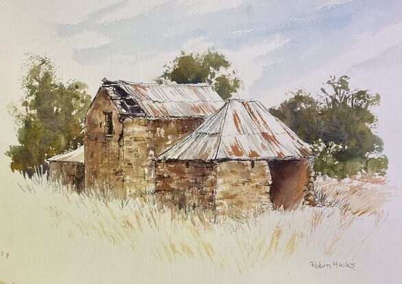 Old stone ruins on dry grassy land