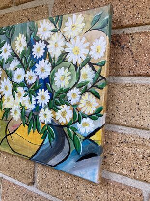 Gold vase full of white daisies. 