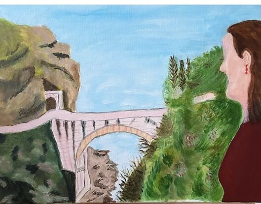 Lady looking down on sea & bridge