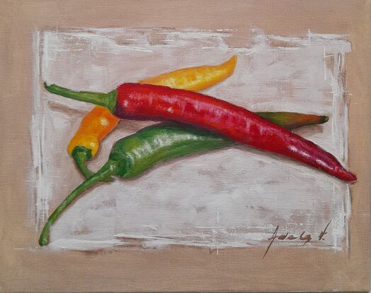 Long green, red and yellow chilies placed on white background 