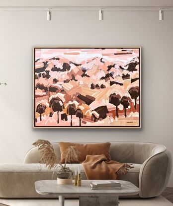 Large framed canvas with a textured landscape scene in earthy tones, orange, pinks, browns abstract hills, trees and foliage shapes chunky paint with visible big brushstrokes.