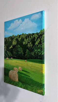 The artwork shows the hay bales in the rural part of North America.