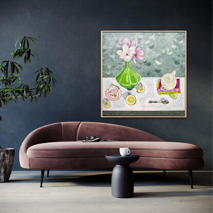 Various domestic objects scattered around within the composition. Magnolia flowers in a green glass vase with cut grapefruit scattered in the foreground.  A teapot on some books and tea cup waiting for tea to be poured.  