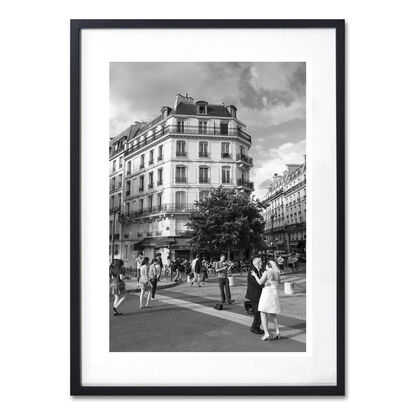 Black and white photograph of wedding couple dancing in street, Paris, France