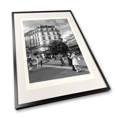 Black and white photograph of wedding couple dancing in street, Paris, France