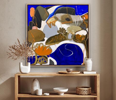 Large blue, orange, white and brown shapes merging together to create a bright seascape