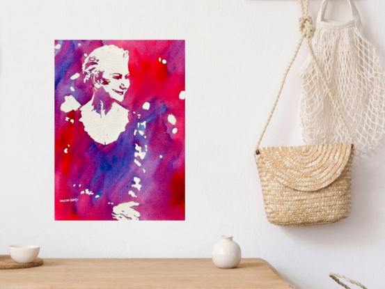 A portrait of Helen Mirren. "Grace in Vibrance" by Christine Beard is a stunning watercolor piece that captures the essence of elegance through minimalistic expression and vibrant colors. The portrait, rendered in a striking duotone palette of red and purple, highlights the graceful silhouette of a figure, embodying both strength and serenity. This artwork is a celebration of simplicity and boldness, making it a perfect addition to any modern art collection that values emotional depth and artistic finesse.





