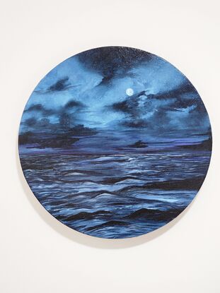 In this evocative acrylic painting, a full moon bathes the sea in a tranquil, blue glow. The scene unfolds on a canvas awash with varying shades of blue, capturing the moon’s radiant light as it reflects gently upon the calm, rippling waters. The moon itself, a luminous orb of soft blues, dominates the night sky, casting an ethereal glow that merges seamlessly with the tranquil seascape below. The artist’s brushwork brings out a subtle texture in the water, enhancing the interplay of light and shadow. The composition exudes a serene, contemplative mood, inviting viewers to lose themselves in the quiet beauty of the moonlit sea.