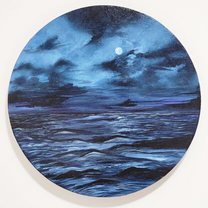 In this evocative acrylic painting, a full moon bathes the sea in a tranquil, blue glow. The scene unfolds on a canvas awash with varying shades of blue, capturing the moon’s radiant light as it reflects gently upon the calm, rippling waters. The moon itself, a luminous orb of soft blues, dominates the night sky, casting an ethereal glow that merges seamlessly with the tranquil seascape below. The artist’s brushwork brings out a subtle texture in the water, enhancing the interplay of light and shadow. The composition exudes a serene, contemplative mood, inviting viewers to lose themselves in the quiet beauty of the moonlit sea.