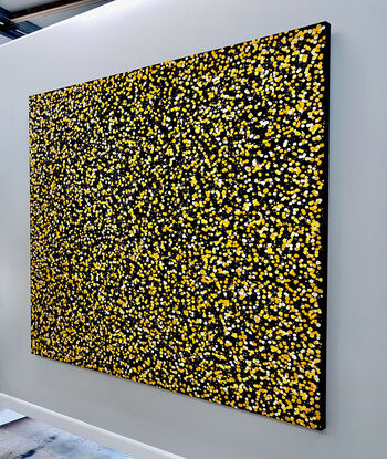 thousands of yellow dots on black canvas