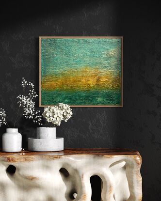 A textured abstract in landscape orientation that features ochre, gold and teal blue and represents a tropical sunset.