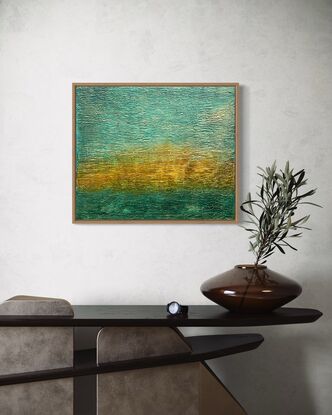 A textured abstract in landscape orientation that features ochre, gold and teal blue and represents a tropical sunset.