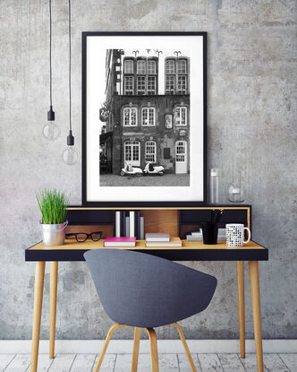 Black and white photograph of narrow street in Paris, France