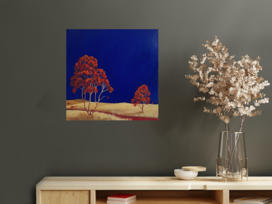 Square Australian landscape with dark blue sky with gold beige foreground, red  trees in foreground, Lucinda Leveille, original artwork, Australiana