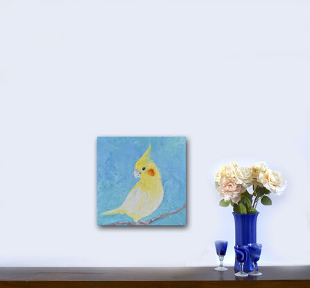 Oil painting portrait of a pet Cockatiel Parrot. This medium sized bird is bright yellow with a yellow crest and orange spot on his face. The background is textured blue.