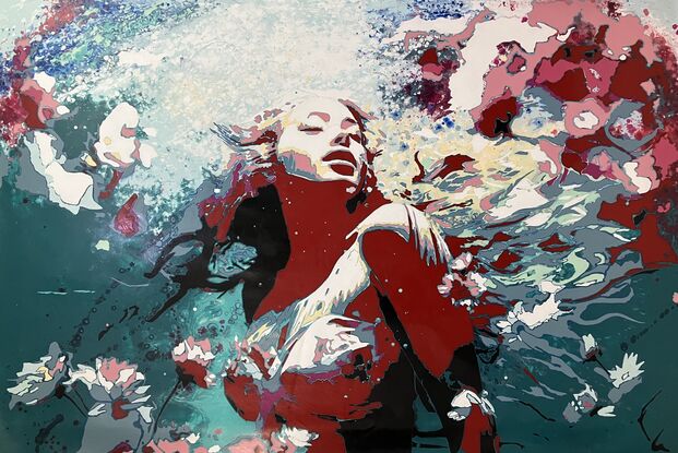 A woman underwater with long hair and flowers swirling around her conveys a sense of freedom.