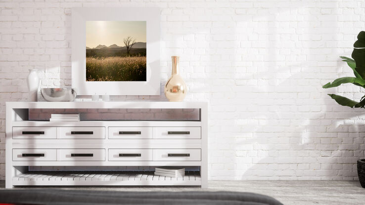 "Outback" photograph showcases rugged Australian wilderness with clay-like landscape and striking light and shadow play. Earthy terracotta tones dominate color palette for a captivating image.