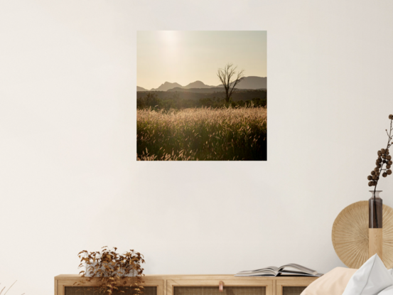 "Outback" photograph showcases rugged Australian wilderness with clay-like landscape and striking light and shadow play. Earthy terracotta tones dominate color palette for a captivating image.