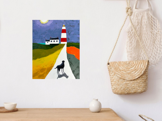 Palette knife painting of a night time scene of a black dog  with shadow walking on a white path in the Irish countryside towards a red and white striped lighthouse next to the coast. There is a white cottage next to the lighthouse and a small glimpse of the aqua coloured sea. The sections of land beside the path are coloured, yellow, olive green, orange and dark green. The sky is coloured lilac purple and grey blue with  a full moon. 