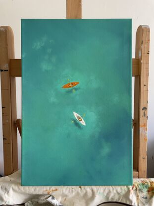 Bright orange and white kayaks on turquoise water