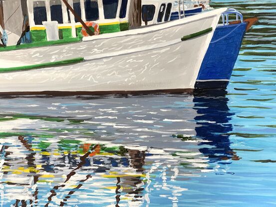 Trawlers and boats and their reflections on a still cold sunny morning.