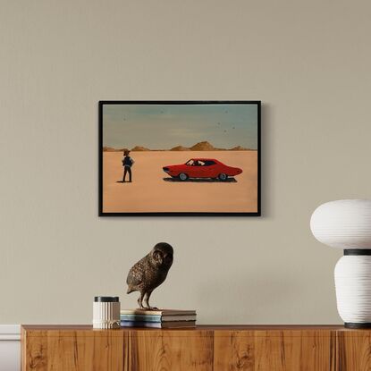 A dusty desert landscape, mountains in the backgound. In the middleground, a cowboy stands with his hands on his hips, facing a red classic car in a standoff position.