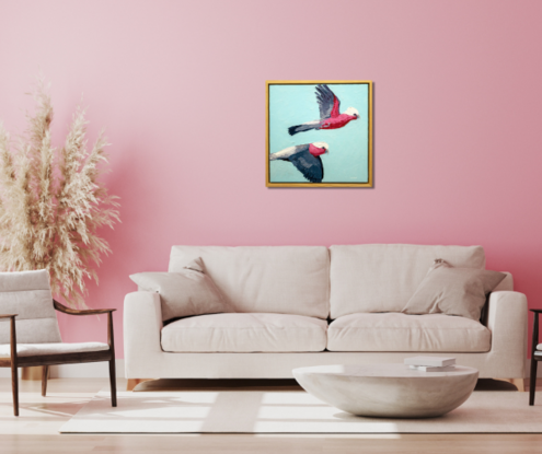 A textured oil painting of two pink galahs flying across the blue sky.