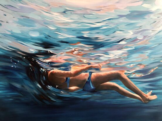 Woman floating in the water. 