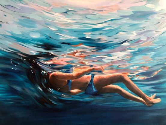 Woman floating in the water. 