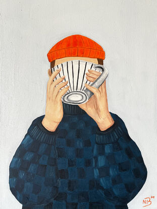 Person with scarf drinking coffee