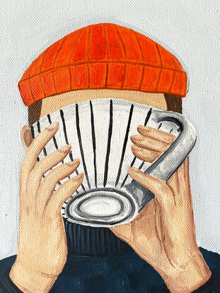 Person with scarf drinking coffee